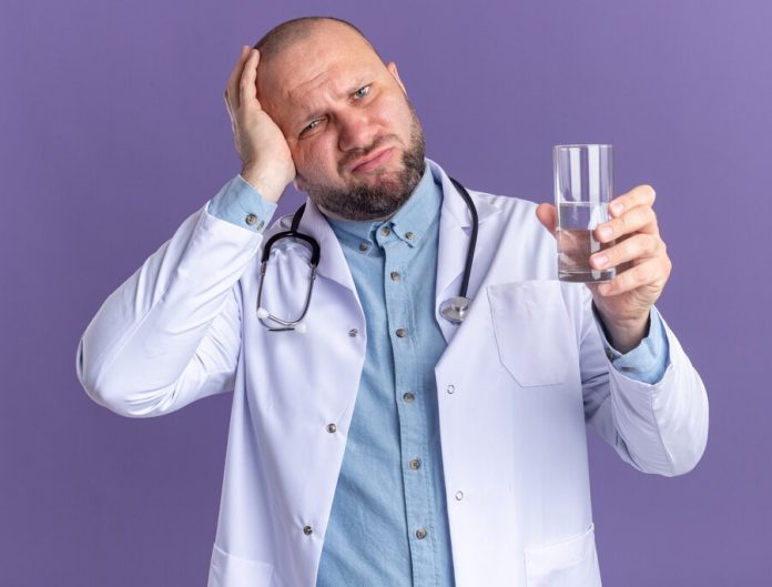 https://ru.freepik.com/free-photo/regretting-middle-aged-male-doctor-wearing-medical-robe-and-stethoscope-holding-glass-of-water-keeping-hand-on-head-looking-at-front-isolated-on-purple-wall_16181739.htm#fromView=search&page=1&position=5&uuid=ef59266c-5f92-49d0-a146-9cc392184f51